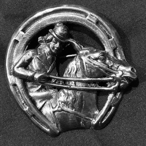 This is a beautiful sterling silver equestrian pin (brooch).
